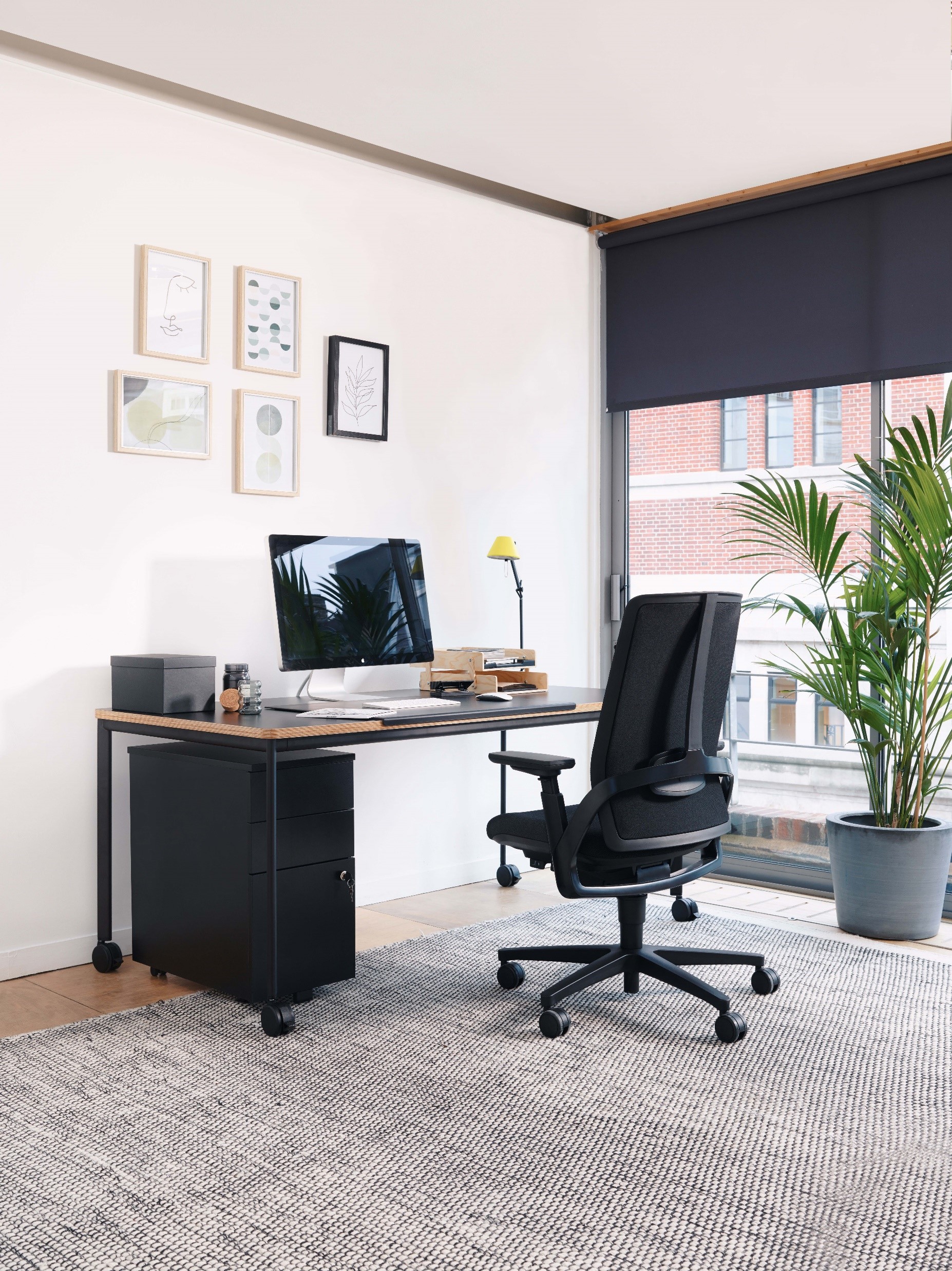 home office with black chair and desk